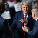 President Donald Trump points to US Senator Tim Scott, left, Republican of South Carolina, alongside US Senator Lindsey Graham, right, Republican of South Carolina, during a Keep America Great campaign rally at the North Charleston Coliseum in North Charleston, South Carolina, February 28, 2020.